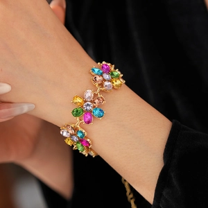 Detail of vintage flower bracelet with multicolor crystals on a gold-plated base