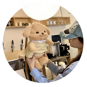Detail of cute teddy bear plush backpack for girls with lace dress and adjustable straps