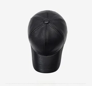 Top down view of black leather baseball cap showing hexagonal stitch pattern and crown button