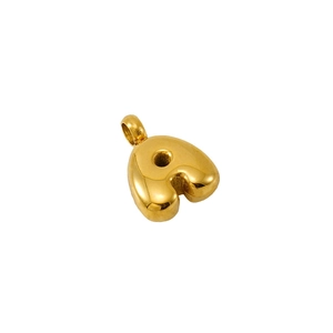 Minimalist golden heart bubble pendant in polished stainless steel on white background
