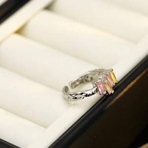 Silver hammered open ring with colorful pink yellow and orange rectangular gemstones