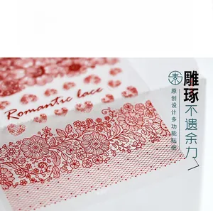 Macro detail of Romantic Lace KX016 nail art sticker with intricate red floral patterns