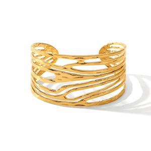 Detailed view of wide 18K gold plated cuff bracelet with layered organic textures
