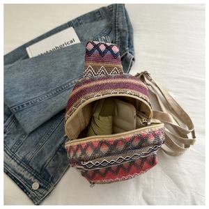 Ethnic woven chest bag featuring colorful geometric patterns and functional zipper closure