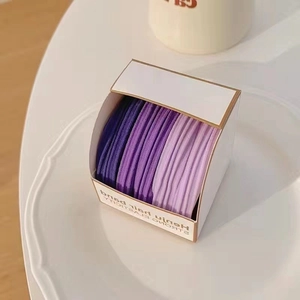 Detail of gradient purple high elasticity hair bands in elegant white gift packaging