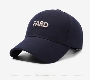Detail of dark blue baseball cap with white FARD embroidery and twill texture