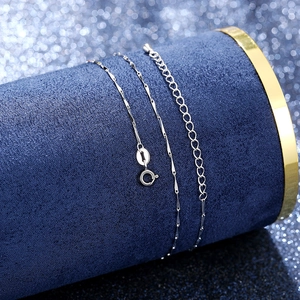 Detail of silver chain necklace showing spring clasp and adjustable extension link