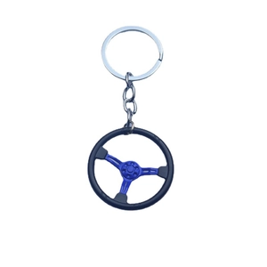 Blue car steering wheel keychain made of zinc alloy with black anti-slip outer ring details