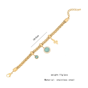 Detailed shot of golden stainless steel flower bracelet with turquoise stone pendants