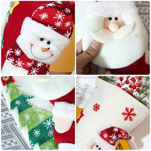 Detailed view of Christmas stocking fabrics featuring Santa, snowman and knit patterns