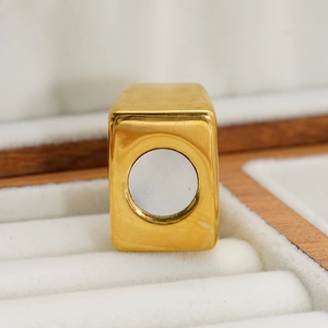 Macro detail of 18k gold plated rectangular ring with white mother of pearl inlay