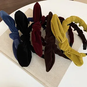 Collection of retro velvet knotted bow headbands in various vintage colors for women