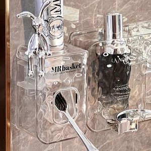 Wall-mounted glacier pattern toothbrush holder with a silver rabbit ornament in bathroom