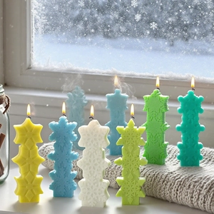 Three-tier snowflake scented candle set in vibrant colors for winter home decor