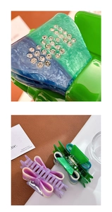 Macro detail of acetate hair claw clips with rhinestone accents and bow design