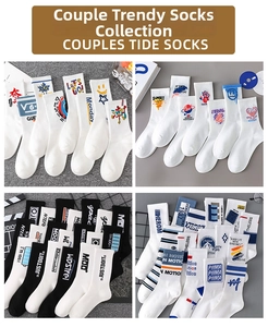 Detailed view of mid-calf cotton sports socks with retro graffiti and letter patterns