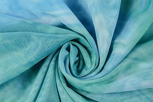 Detail of blue and green gradient mesh fabric with a fine breathable honeycomb texture