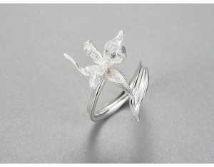 Detailed view of S925 silver iris ring showing matte petals and polished band texture
