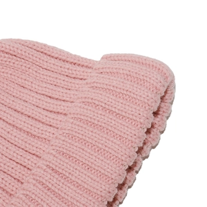 Close-up of the soft pink ribbed knit beanie showing high-quality woven texture