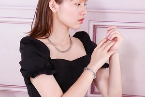 Silver stainless steel anchor chain necklace and bracelet set shown on model