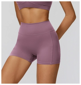 Close-up of mauve brushed high-waist yoga shorts showing seamless texture and fit