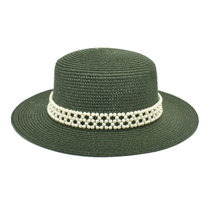 Detail of dark green woven boater hat with decorative triple-row pearl band