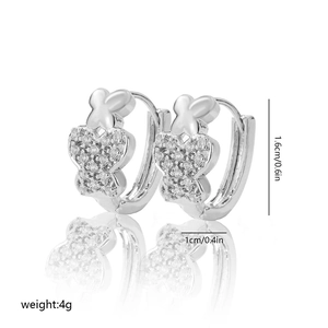 Detail view of silver butterfly hoop earrings with dimensions 1.6cm by 1cm and 4g weight
