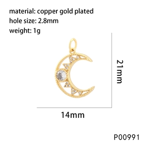 Detail of gold plated copper moon pendant with clear gemstones and 21mm dimensions