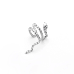 Close-up detail of silver snake ear cuff showing realistic scales and intricate textures