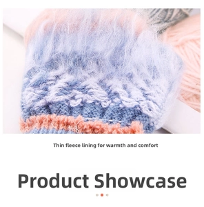 Detailed close-up of warm white fleece lining on colorful knit cartoon cat gloves