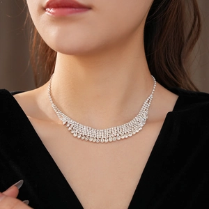 Close-up of sparkling silver multilayer rhinestone tassel necklace on a model