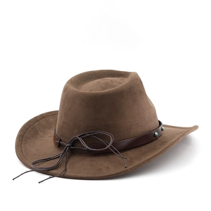 Detail of dark brown suede cowboy hat with studded leather band and vintage accents