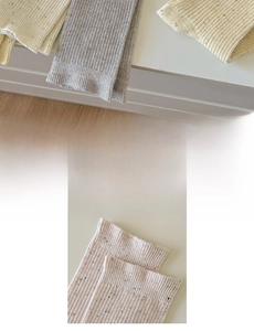 Detailed view of ribbed knit mid-length socks with colorful confetti melange yarn accents