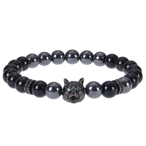 Detailed view of 8mm blue tiger eye beads and micro-set zircon wolf head charm on bracelet