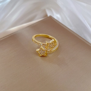Elegant gold plated open ring featuring double star motifs set with shimmering zircon stones