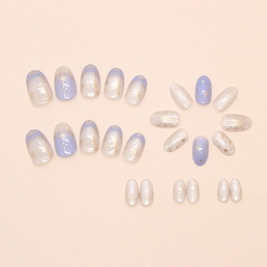 French press-on nails set with purple glitter stars and moon celestial designs