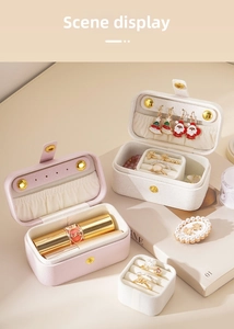 Detail view of portable PU leather jewelry box showing interior ring slots and ear stud plate