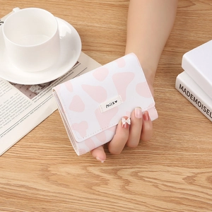 Three-fold mini wallet with cow print and Milk heart logo tag on cross-pattern PU leather