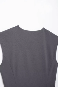 Close-up of the back neckline on a dark grey sleeveless commuter vest in woven fabric