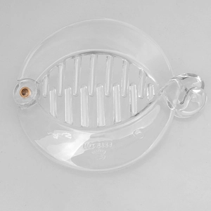 Detailed top view of a clear acrylic fish-shaped banana hair clip with comb teeth