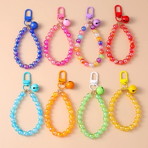Set of 8 colorful beaded keychains with bells and metal clasps in various vibrant shades