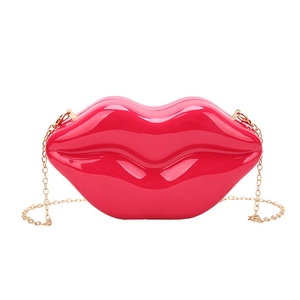 Creative red lip shaped acrylic clutch bag with a golden metal chain shoulder strap