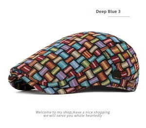 Detail of multi-color woven geometric pattern and metal buckle on deep blue beret