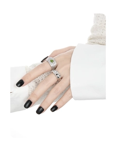 Detailed close-up of S925 silver layered rings with green gemstone and textured stripes