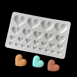 Silicone heart mold for chocolate and cake decor with colorful finished heart shapes
