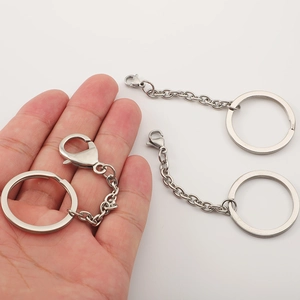 Polished stainless steel keychain ring with lobster clasp and chain link set on white background