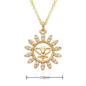 Detailed macro view of 18k gold swallow totem pendant with 17.8mm width and zircons