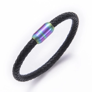 Close-up of black braided leather bracelet with rainbow metallic magnetic clasp closure