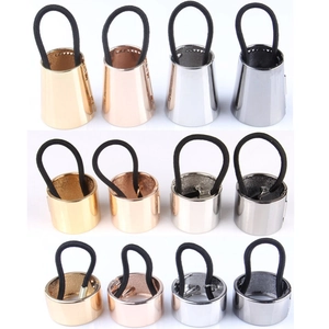 Set of 12 stylish metal ponytail cuffs in gold silver and black on a white background