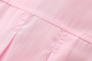 Detail view showing professional double stitching and pink cotton fabric texture